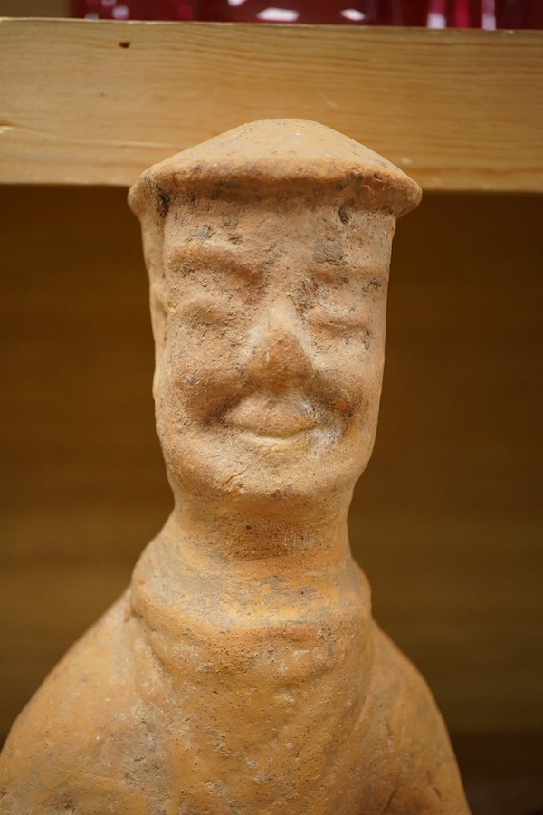 A Han Dynasty-style Chinese terracotta figure, 44cm high. Condition - fair